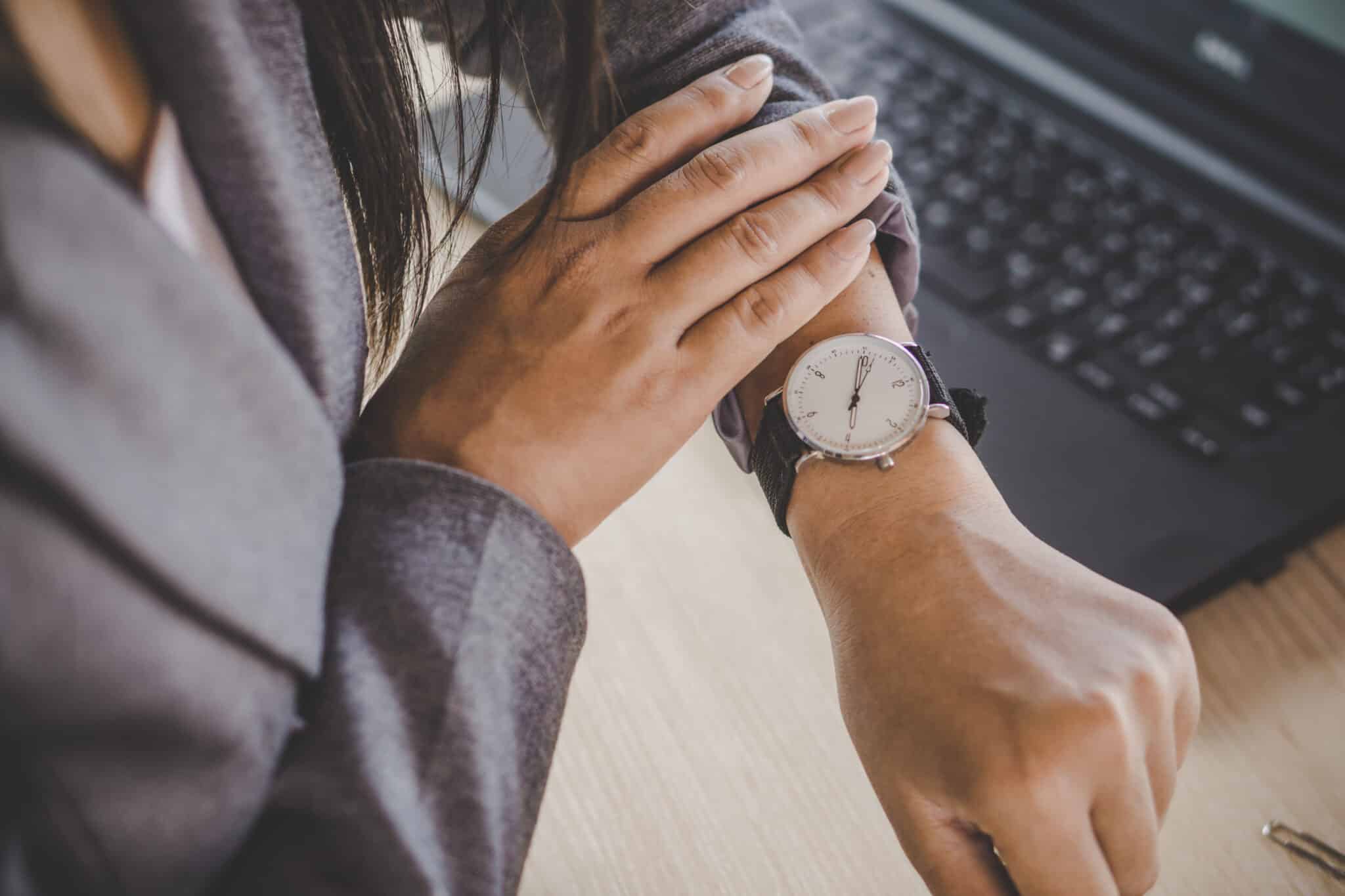 Lawyer checking the time on watch